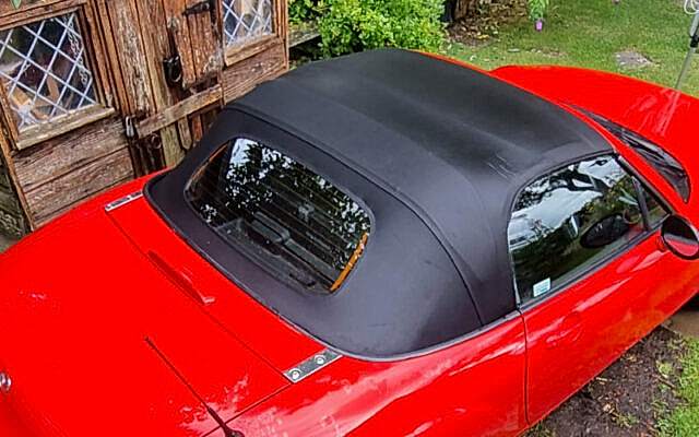 Clean red mazda convertible roof photo